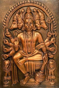 an intricately carved golden statue depicting the hindu god with his four avatars on it