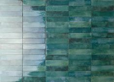 an abstract painting with green and blue tiles