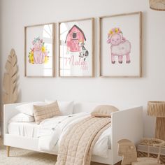 a child's bedroom with three pictures on the wall