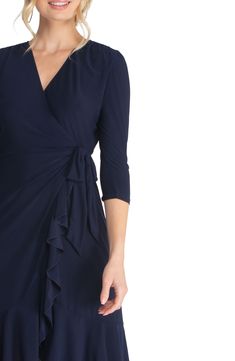 A surplice neckline reveals as little or as much as you want to accentuate on a fab dress that's playfully chic and delightfully drapey. 95% polyester, 5% spandex Machine wash, dry flat Made in the USA of imported fabric Flowy Midi Dress With Surplice Neckline For Formal Occasions, Fitted Maxi Dress With Surplice Neckline For Dinner, Formal Flowy Midi Dress With Surplice Neckline, Dressy Cocktail Dress With Surplice Neckline, Elegant Fitted Ruched Wrap Dress, Flowy Ruched Midi Dress With Surplice Neckline, Elegant Midi Dress With Surplice Neckline For Dinner, Fitted Midi Dress With Ruched Bodice And Surplice Neckline, Flattering Draped Dresses For Formal Occasions