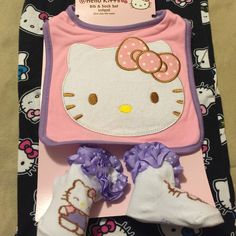 a hello kitty outfit and booties are on display