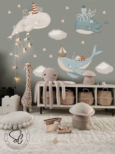 a child's room with an octopus, whale and stars wall decal on the wall