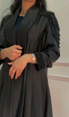 A gorgeous kimono style abaya perfect for the summer months, Ramadan, Eid, or any special occasions. Styling details include hand stitched diamonds and crystals on premium Nida fabric around the sleeves and on the lower sides of the abaya. Discreet snap fastener buttons inside the sleeve for added comfort. You are bound to receive compliments with this elegant piece. No refunds No exchanges final sale pricesCustomised productplease note that the Abaya may at times, have minimal & slight imperfec Work Abaya, Mode Kimono, Mode Abaya, Abaya Designs, Abaya Dress, Abayas Fashion, Abaya Fashion, Color Free, Wide Sleeves