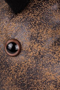 an elephant's eye is seen in this close up photo, with brown and black speckles