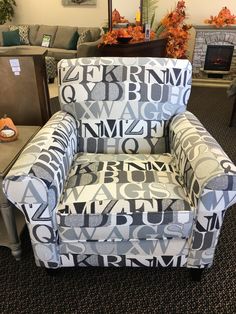 a blue and white chair with letters on it