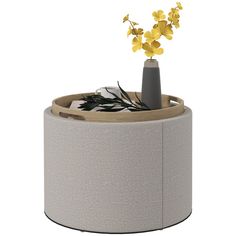 a vase with yellow flowers in it on top of a round table or stools