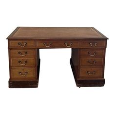 an old wooden desk with drawers on it