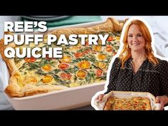 a woman holding up a pizza in front of a pan with the words reese's puff pastry quiche