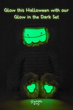 glow in the dark shoes with glowing green eyes and hands are shown against a black background