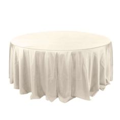 a round table with white cloth on it