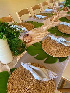 the table is set with plates and placemats for guests to sit down at