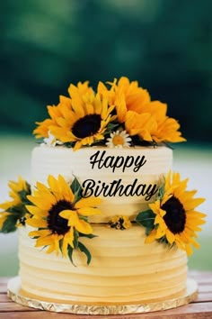 a birthday cake with sunflowers on top