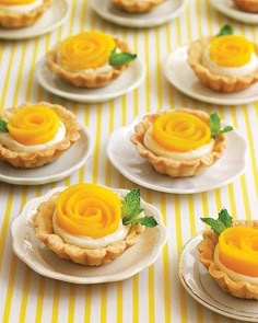 there are many small pies with flowers on the top one is yellow and white