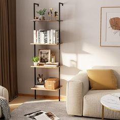 a living room filled with furniture and a book shelf next to a white couch in front of a window