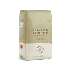 a bag of coffee sitting on top of a white tablecloth with the words pasta d'oro primita