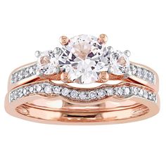 two tone gold wedding ring set with an oval cut diamond and round diamonds on each band