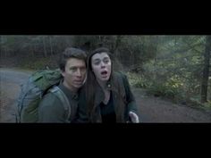 two people are standing in the woods with their mouths open and one person is surprised