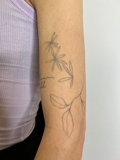 a woman with a tattoo on her arm