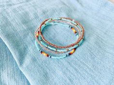 This beachy bracelet set is so dainty and would make a nice gift. Stack these together, with other bracelets, or wear them by themselves! They are perfect for everyday wear! ∙ ∙ ∙ ∙ ∙ ∙ ∙ ∙ ∙ ∙ ∙ ∙ ◆ MATERIALS ◆ * High Quality Beading Elastic * Seed Beads of Various Colors ∙ ∙ ∙ ∙ ∙ ∙ ∙ ∙ ∙ ∙ ∙ ∙ ◆ SIZES ◆ This bracelet set is made to order so you can order it in whatever size you need. If you need a custom size please let me know. ∙ ∙ ∙ ∙ ∙ ∙ ∙ ∙ ∙ ∙ ∙ ∙ ◆ FINDING THE RIGHT SIZE ◆ You can find Small Beaded Bracelet, Beachy Bracelets, Beach Bracelet, Bracelet Minimalist, Beach Bracelets, Seed Bead Bracelet, Bracelet Dainty, Dainty Bracelet, Dainty Bracelets