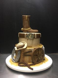 a birthday cake made to look like a train with wheels and boots on the side