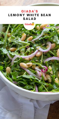 a white bowl filled with greens and beans