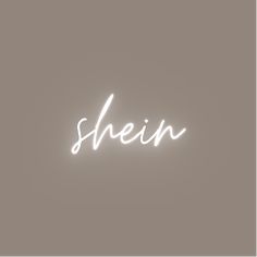 the word shein written in white neon lights on a gray background with no shadow