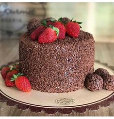 a chocolate cake with strawberries on top