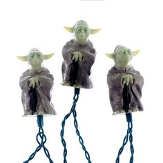 three star wars yoda lights are hanging from cords