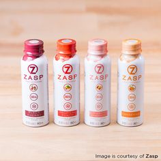 three bottles of zasp on a wooden surface