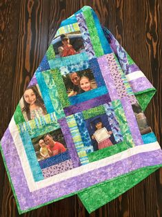 a quilted table topper with pictures of people in the center and on it