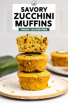 three vegan zucchini muffins stacked on top of each other