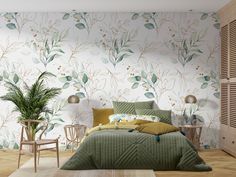 a bedroom with green bedding and floral wallpaper, along with a plant in the corner