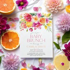 the baby brunch is on display next to oranges and flowers