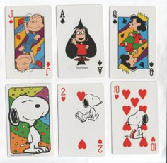 four playing cards with cartoon characters on them, all in different shapes and sizes are shown