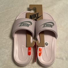 Nike Victori One Slides. Size 7, In Barely Rose/Metallic Silver. New With Tags In Original Box. Nike Victori One Slides, Nike Slides, Shoes Nike, Women's Shoes Sandals, Nike Shoes, Metallic Silver, Nike Women, Original Box, Shoes Sandals