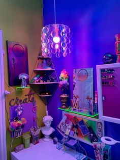 a room filled with lots of colorful lights and decor on the walls, including a desk