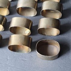 an assortment of metal rings sitting on top of a table