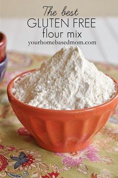 a bowl filled with flour sitting on top of a table