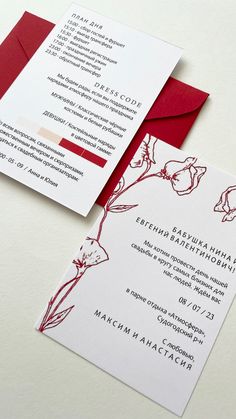 two red and white wedding cards on top of each other