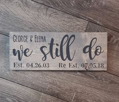 a wooden sign that says we still do on the side of a wood plank wall