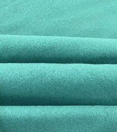 a close up shot of the fabric in aqua green color, with very soft texture