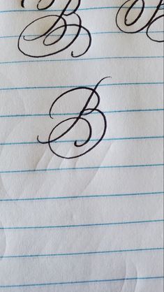 some type of writing on lined paper with the letter b