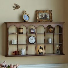 a shelf that has some clocks on it