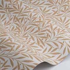 a wallpaper with gold leaves on it