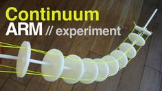 an arm made out of plastic tubes on a wooden floor with the words continuum arm / experiment