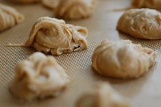 the doughnuts are ready to be baked in the oven