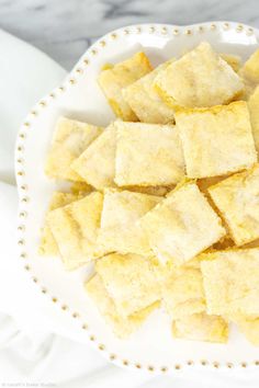 a white plate topped with cut up squares of food