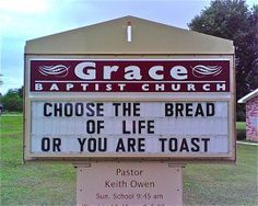 a sign that says grace baptist church choose the bread of life or you are toast