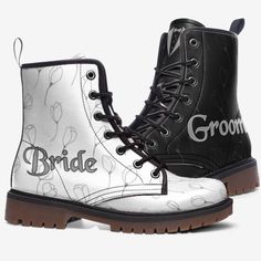 a pair of black and white boots with the word bride printed on them, sitting next to each other