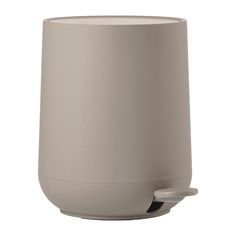 a white cup with a handle on the top and bottom is sitting in front of a white background